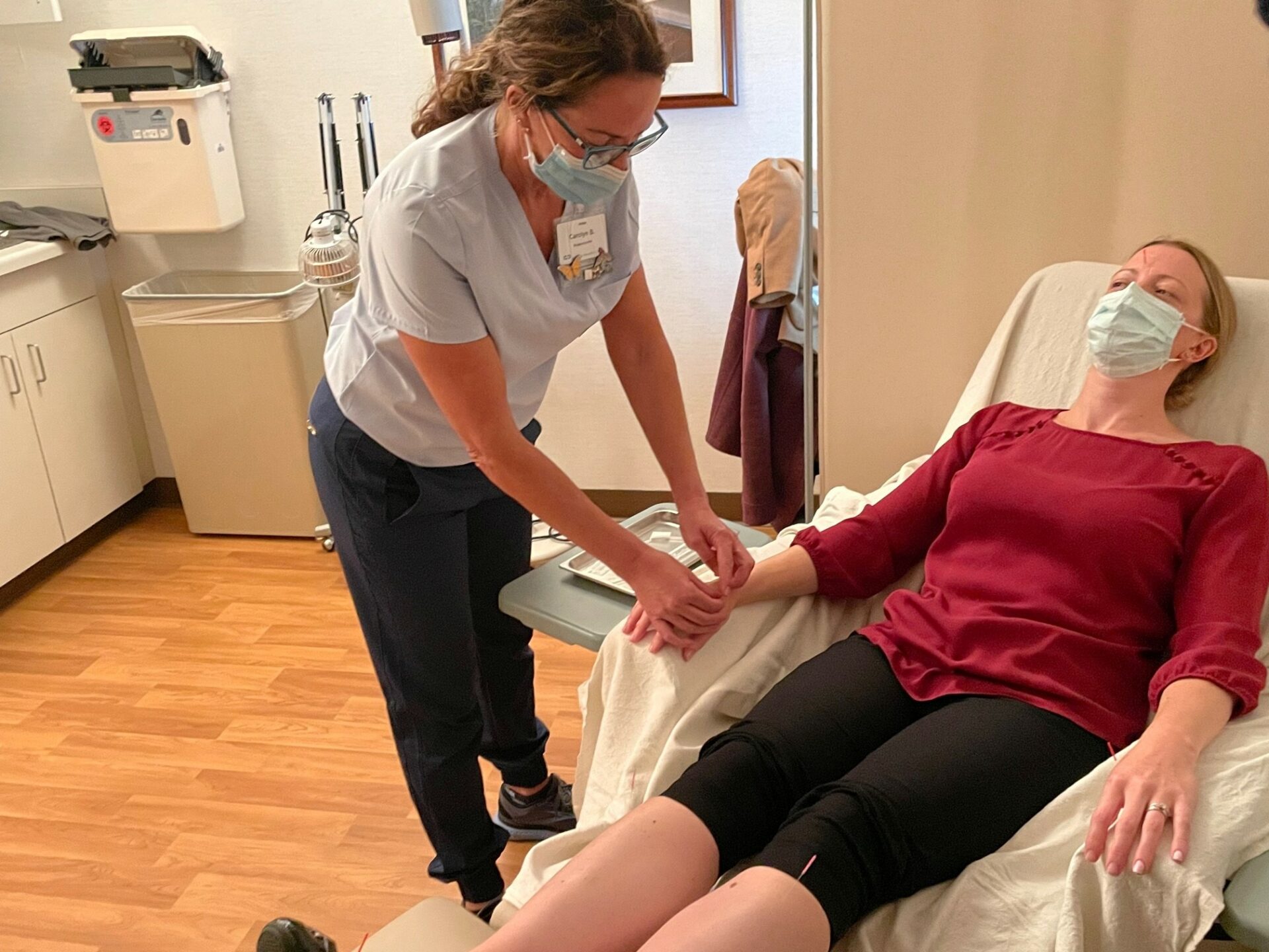 A woman getting acupuncture.